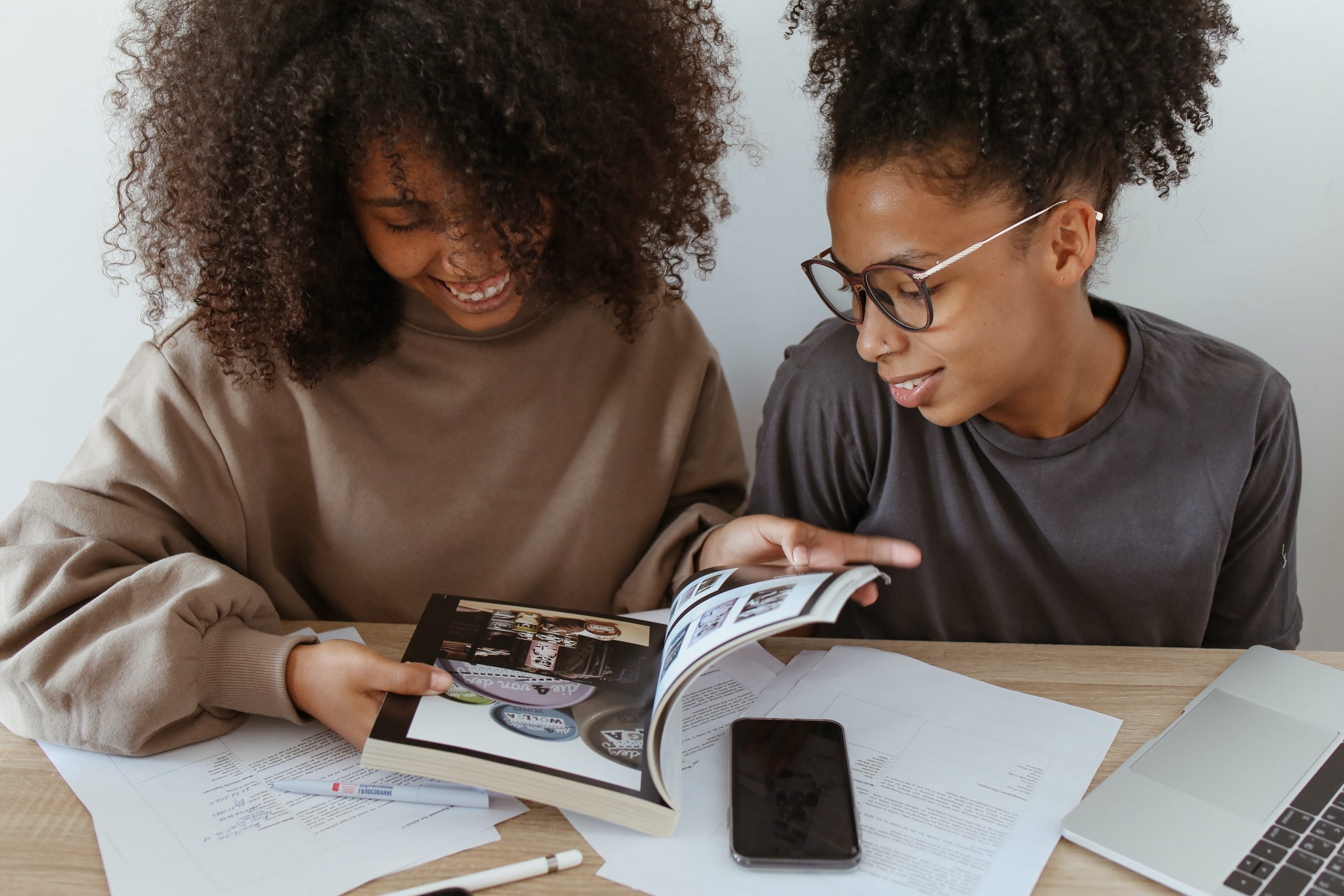 Student and parent reviewing a book together